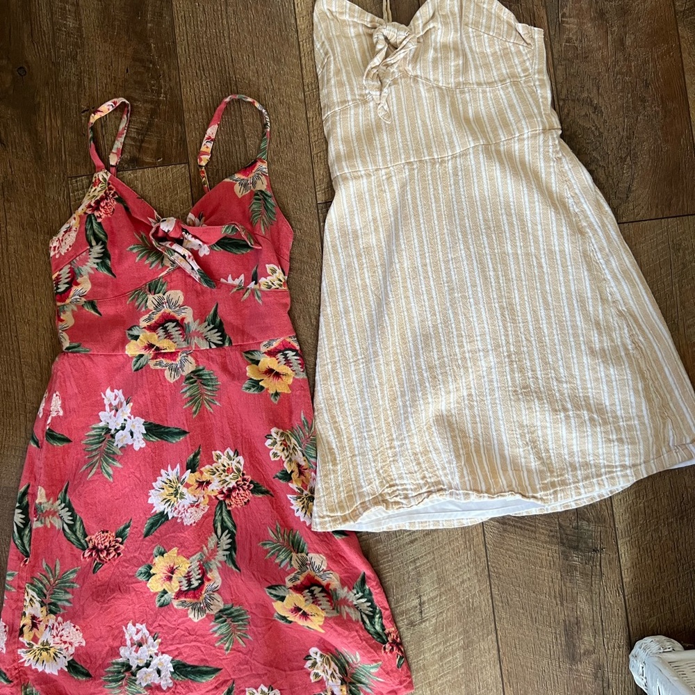 TWO HOLLISTER DRESSES, PINK WITH FLOWERS AND YELLOW AND WHITE STRIPES, XS